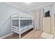 A cozy bedroom featuring a white bunk bed and neutral-toned decor at 5905 South Kings Hwy. # A337, Myrtle Beach, SC 29575