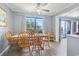 Light-filled dining room with a wood table and a large window providing beautiful views at 5905 South Kings Hwy. # A337, Myrtle Beach, SC 29575