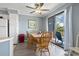 Bright dining room with a wooden table set, and balcony access for serene views at 5905 South Kings Hwy. # A337, Myrtle Beach, SC 29575