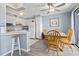 Bright dining area featuring a dining table, kitchen access, and balcony views at 5905 South Kings Hwy. # A337, Myrtle Beach, SC 29575