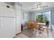Bright dining area adjacent to kitchen with wood table and access to outdoor balcony at 5905 South Kings Hwy. # A337, Myrtle Beach, SC 29575