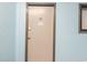 Apartment door at 337 featuring metal door and frame on a light blue hallway wall at 5905 South Kings Hwy. # A337, Myrtle Beach, SC 29575