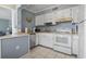 Well-lit kitchen offering white appliances, light countertops, and a breakfast bar at 5905 South Kings Hwy. # A337, Myrtle Beach, SC 29575