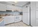 Bright kitchen featuring white cabinetry, tile floors and modern appliances at 5905 South Kings Hwy. # A337, Myrtle Beach, SC 29575