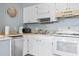 Functional kitchen with white appliances, light countertops, and ample cabinet space at 5905 South Kings Hwy. # A337, Myrtle Beach, SC 29575