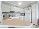 Bright kitchen featuring white cabinetry, tile floors and modern appliances at 5905 South Kings Hwy. # A337, Myrtle Beach, SC 29575