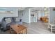 Comfortable living room flowing to a dining area and kitchen with wood flooring at 5905 South Kings Hwy. # A337, Myrtle Beach, SC 29575
