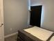 Bedroom featuring a bed with neutral colored bedding and a dark curtained window at 613 Todd Blvd., Conway, SC 29526