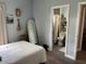 Comfortable bedroom with personal decor, a full-length mirror and a view of the bathroom at 613 Todd Blvd., Conway, SC 29526