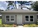 Exterior view of house 613 featuring vinyl siding, new windows, and tasteful landscaping at 613 Todd Blvd., Conway, SC 29526