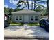 Charming single-story home featuring a gray exterior, well-manicured landscaping, and a wide concrete driveway at 613 Todd Blvd., Conway, SC 29526