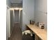 Long hallway featuring a wooden desk and chair in the corner, doors leading to the rooms and attick at 613 Todd Blvd., Conway, SC 29526