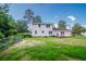 Large backyard with a deck offers outdoor living and entertaining space at 66 Johnstone Ln., Georgetown, SC 29440
