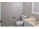 Cozy half-bathroom with toilet and sink featuring neutral paint at 66 Johnstone Ln., Georgetown, SC 29440
