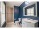 Bathroom with tile shower, commode, and vanity with solid surface counter at 66 Johnstone Ln., Georgetown, SC 29440