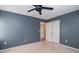 Bedroom featuring dark gray walls, white doors and ceiling fan at 66 Johnstone Ln., Georgetown, SC 29440