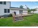 Backyard deck with stairs and grill overlooking the backyard at 66 Johnstone Ln., Georgetown, SC 29440