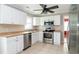 Bright kitchen with white cabinets and stainless steel appliances, including range and microwave at 66 Johnstone Ln., Georgetown, SC 29440