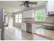 Open kitchen features stainless steel appliances, a breakfast nook, and natural light at 66 Johnstone Ln., Georgetown, SC 29440