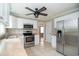 Well-lit kitchen boasting stainless steel appliances, ample counter space, and stylish fixtures at 66 Johnstone Ln., Georgetown, SC 29440