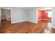 Open living room with hardwood floors, neutral walls, and staircase access at 66 Johnstone Ln., Georgetown, SC 29440