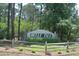 Belle Isle community sign surrounded by a well-maintained green lawn and landscaping at 66 Johnstone Ln., Georgetown, SC 29440