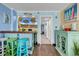 Charming bar area featuring colorful stools with views of the TV and hall leading to the bedroom at 6900 N Ocean Blvd. # 1541, Myrtle Beach, SC 29572