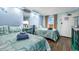 Light blue bedroom features two beds with ocean-themed bedding, and small side table at 6900 N Ocean Blvd. # 1541, Myrtle Beach, SC 29572