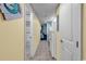 Hallway featuring cream walls, a tiled floor, and access to the bathroom, kitchen, and bedroom at 6900 N Ocean Blvd. # 1541, Myrtle Beach, SC 29572
