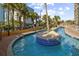 Relaxing lazy river winds through lush landscaping, offering a serene escape with clear blue waters and island features at 6900 N Ocean Blvd. # 1541, Myrtle Beach, SC 29572