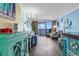 Bright living room with ocean view, light blue walls, ocean-themed furniture, and hardwood floor at 6900 N Ocean Blvd. # 1541, Myrtle Beach, SC 29572