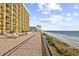 Relaxing oceanfront balcony with hammocks and lounge chairs, ideal for soaking in the sun and enjoying the sea breeze at 6900 N Ocean Blvd. # 1541, Myrtle Beach, SC 29572