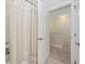 Bathroom view showing a shower with curtain and a view into the carpeted hallway at 721 Mckinley Way, Myrtle Beach, SC 29577