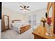 Well-lit bedroom with a ceiling fan, queen bed, and wooden furniture set at 721 Mckinley Way, Myrtle Beach, SC 29577