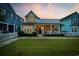 Charming yellow two-story home with a porch, white picket fence, and green lawn at 721 Mckinley Way, Myrtle Beach, SC 29577