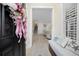 Bright foyer with a bench, decorative pillows, and a glimpse into the living spaces at 721 Mckinley Way, Myrtle Beach, SC 29577