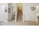 Hallway leading to carpeted stairs and a view of the upper level at 721 Mckinley Way, Myrtle Beach, SC 29577