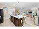 Open-concept kitchen with a large island, modern appliances, and plenty of counter space at 721 Mckinley Way, Myrtle Beach, SC 29577
