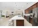 Open kitchen featuring an island with bar seating and a view into the living and dining areas at 721 Mckinley Way, Myrtle Beach, SC 29577