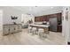 Open kitchen with breakfast bar, stainless steel appliances, and view to the dining area at 721 Mckinley Way, Myrtle Beach, SC 29577