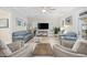 Bright and airy living room with a modern ceiling fan and a neutral color palette at 721 Mckinley Way, Myrtle Beach, SC 29577