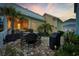 Outdoor patio with dining set, grill, and tropical plants at 721 Mckinley Way, Myrtle Beach, SC 29577