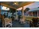 Cozy porch with rocking chairs and a ceiling fan at 721 Mckinley Way, Myrtle Beach, SC 29577