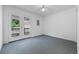 Carpeted bedroom with a ceiling fan and access to an outdoor deck area through double glass doors at 7288 Schooners Ct. Sw, Ocean Isle Beach, NC 28469