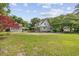 Charming home featuring a detached garage and a large manicured lawn at 7288 Schooners Ct. Sw, Ocean Isle Beach, NC 28469