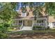 Charming home with a welcoming front porch and mature trees, offering a serene curb appeal at 7288 Schooners Ct. Sw, Ocean Isle Beach, NC 28469