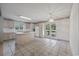 Open kitchen area featuring a center island, tile flooring, and access to an outdoor deck through glass doors at 7288 Schooners Ct. Sw, Ocean Isle Beach, NC 28469