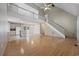 Spacious open-concept living area seamlessly connecting the kitchen with hardwood floors and vaulted ceilings at 7288 Schooners Ct. Sw, Ocean Isle Beach, NC 28469
