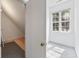 View of a room with beige carpet, a small window with natural light, and an open doorway to another space at 7288 Schooners Ct. Sw, Ocean Isle Beach, NC 28469
