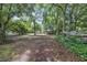 Natural setting with mature trees that provide ample shade at 7288 Schooners Ct. Sw, Ocean Isle Beach, NC 28469